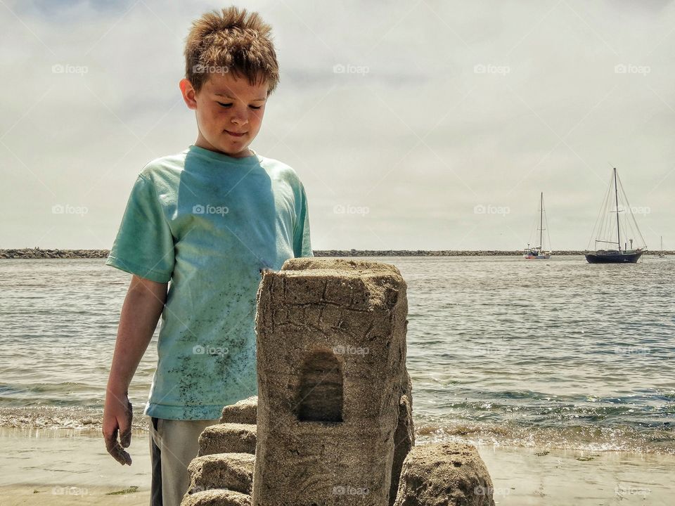 Boy Building A Sandcastle