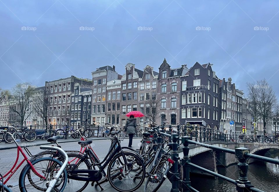 Red umbrella and bikes