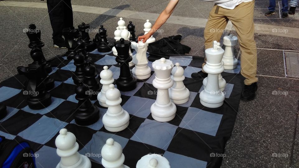 Guys playing outdoor big chess, outdoor games, big chess, summer, recreation