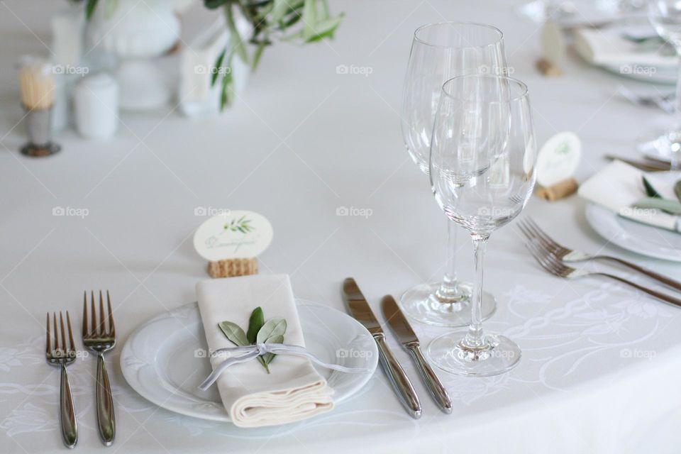 Served wedding table. Simple and beautiful served wedding table. Table served for banquet. Table decorated and served for nice wedding banquet.