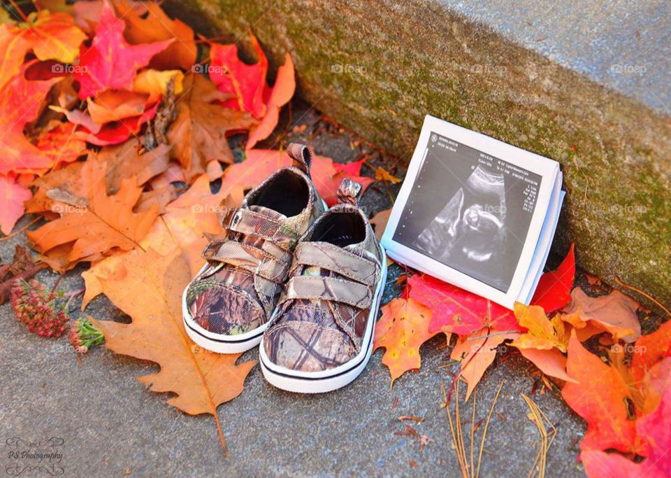 baby shoes and sonogram. baby announcement