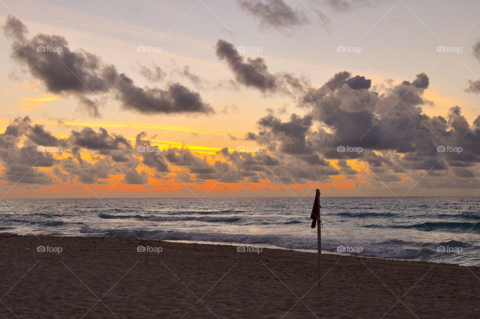 Beach marker at sunrise 