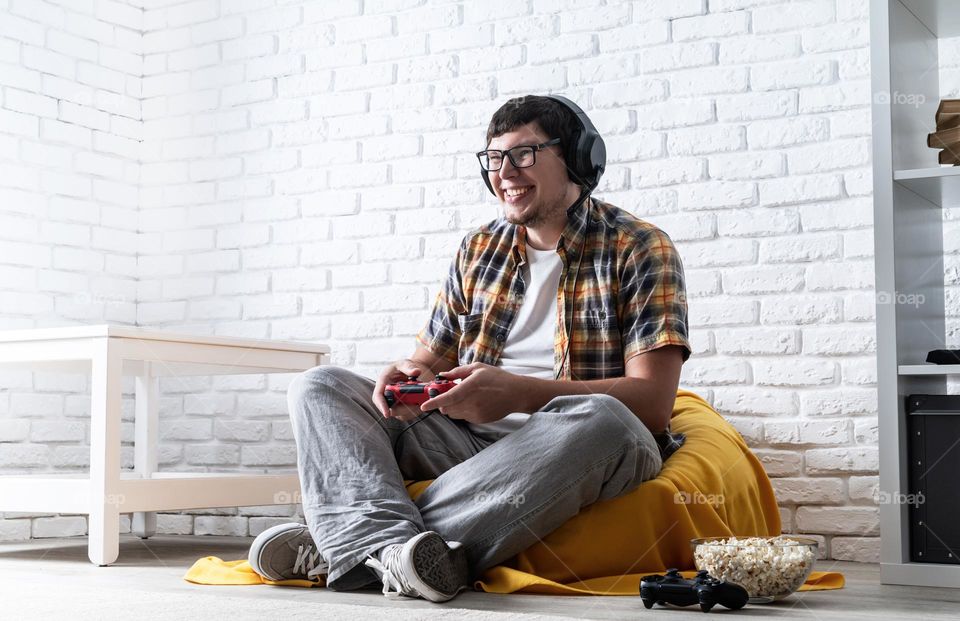 young emotional man playing video games