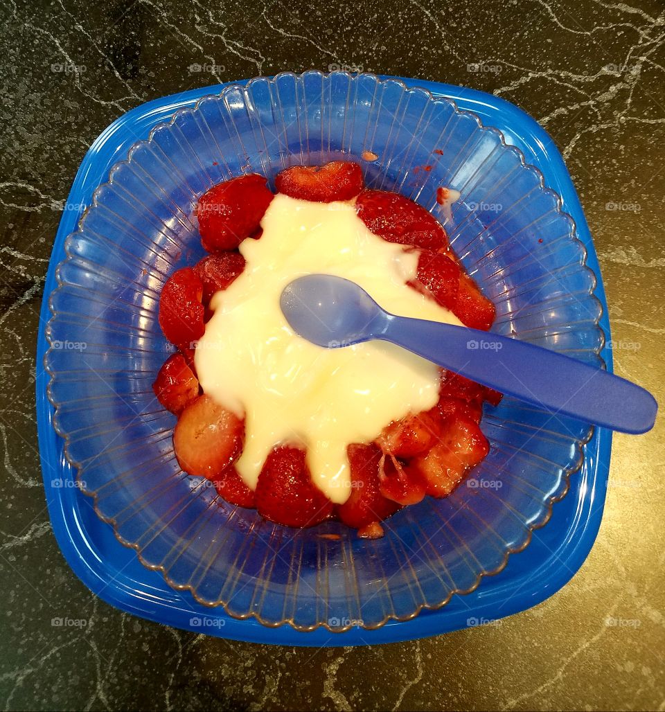 Healthy breakfast of yogurt and strawberries. Low fat, low sugar.