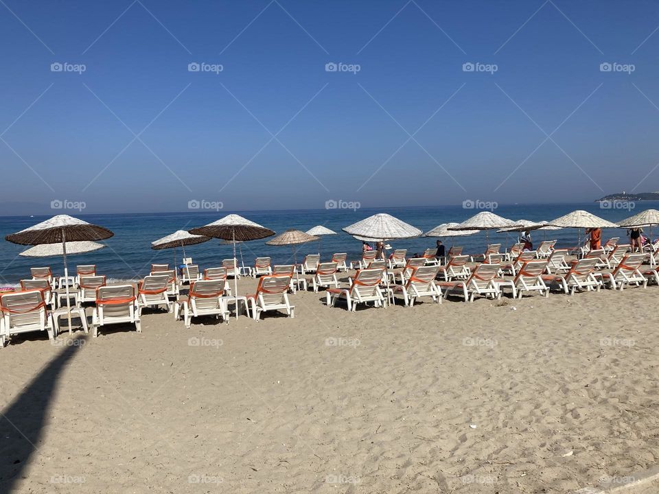 Sightseeing in Turkey. Blue sky and tall palm trees. Sunsets and sunny days. Summertime in Kusadasi. Vacation travel in Turkey . Summer view. Sunny day during vacation. Hidden gems and secret places.