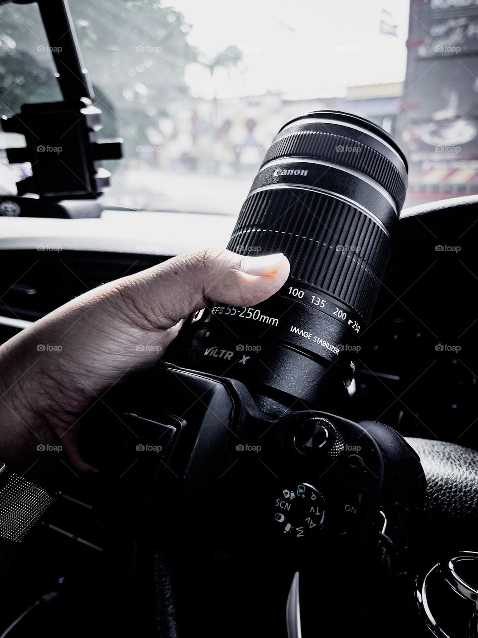 Travelling with a camera and a tumbler of hot coffee for the holiday journey