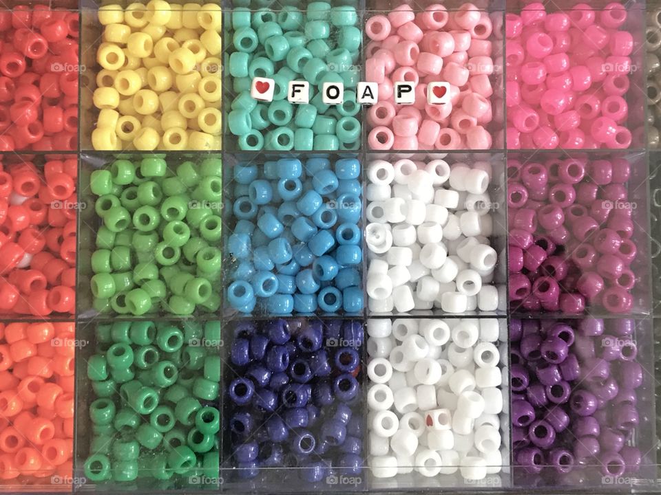 A colorful and bright bead collection that spells the word FOAP 