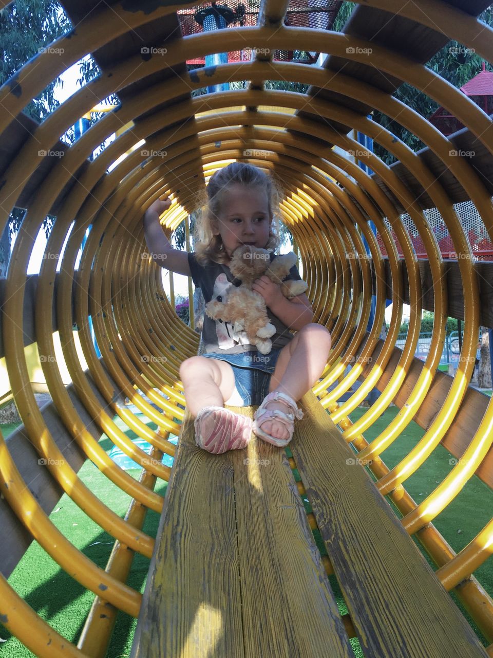 Girl playing on slide