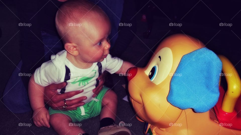 Cute little boy playing with toy