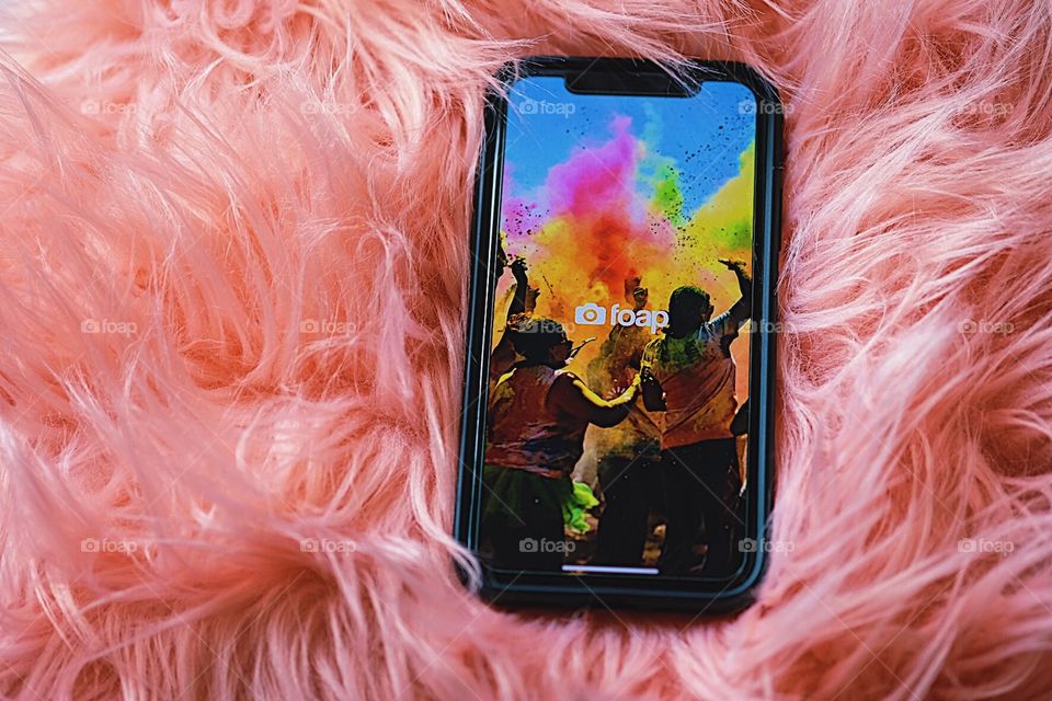 Foap app, Foap on a pink pillow, using the Foap app, Foap for your cell phone, iPhone with the Foap app, brightly colorful digital design, using the Foap app on quarantine