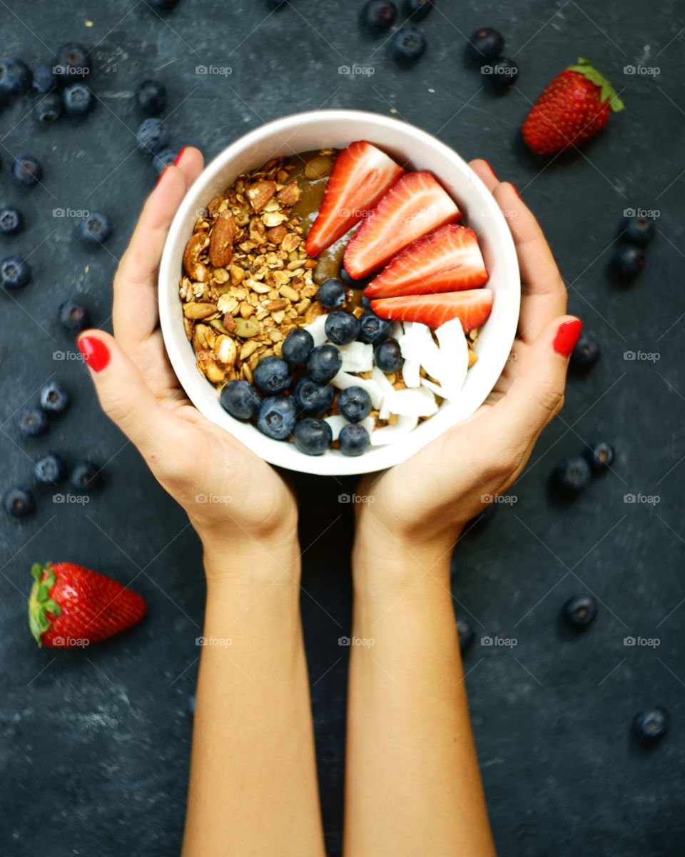 Healthy fruit and berries in smoothie bowl