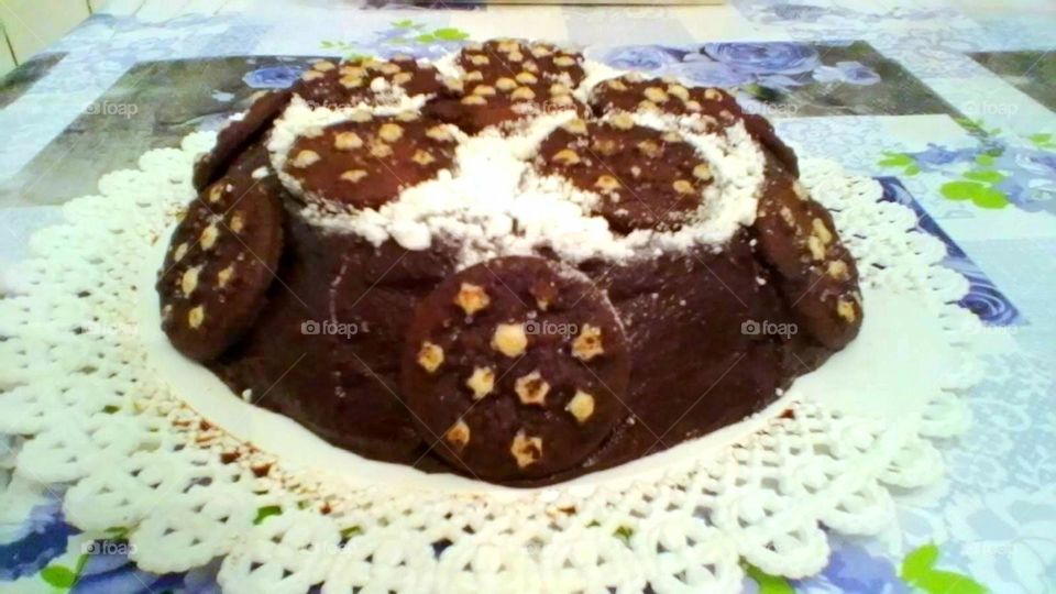 A homemade domed chocolate cake with Pan di Stelle biscuits