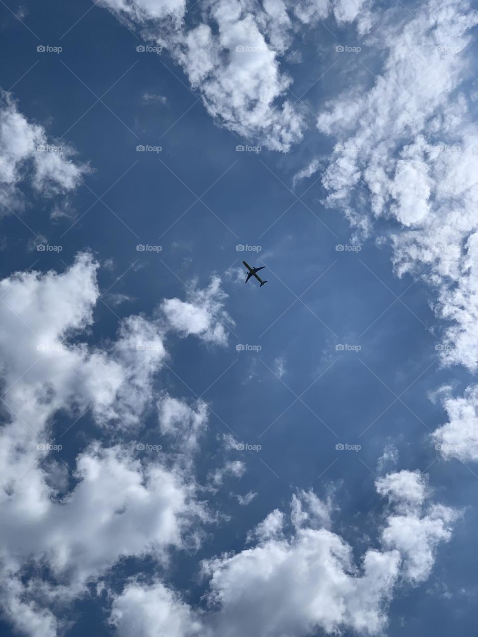 Airplane at the center of the sky