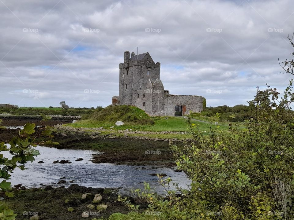 Irish castle, beautiful landscape photograph, seaweed, shoreline, stone buildings