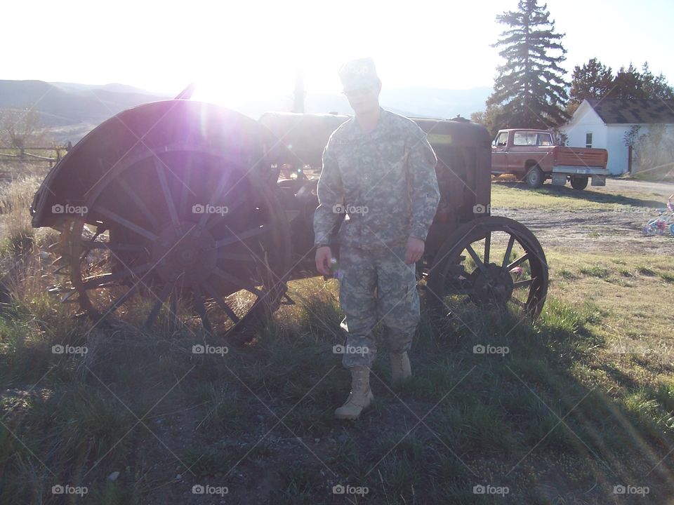 soldier walking from a tractor