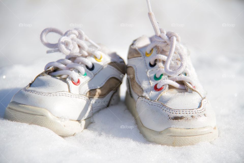 Children s shoes in the snow