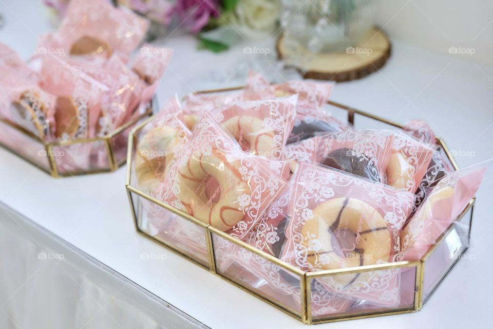 Delicious doughnuts displays for wedding, wedding sweet on white table