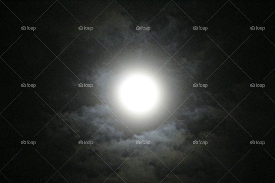 moonlight, moonlit clouds in the midnight sky.