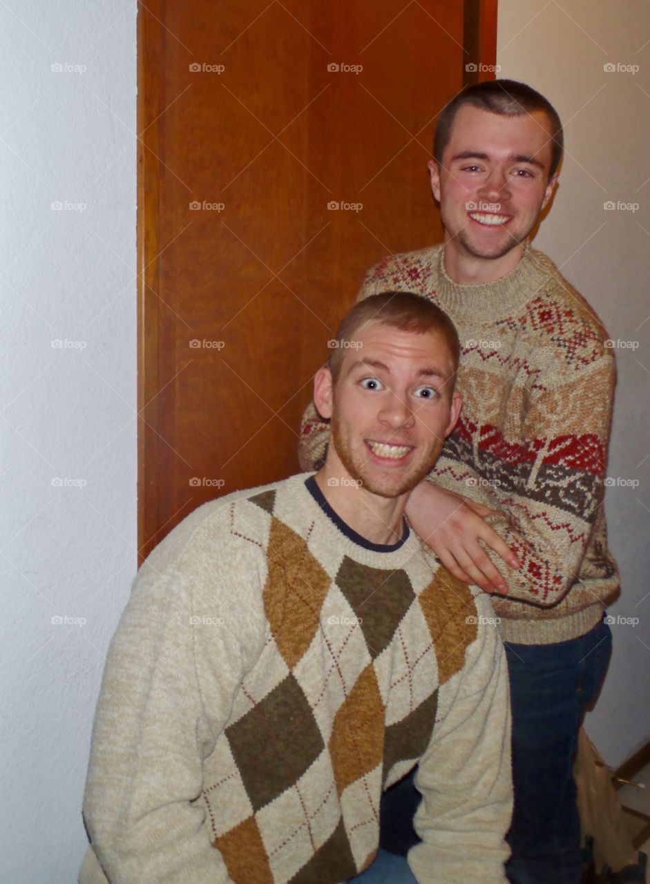 Step brothers pose in ugly sweaters