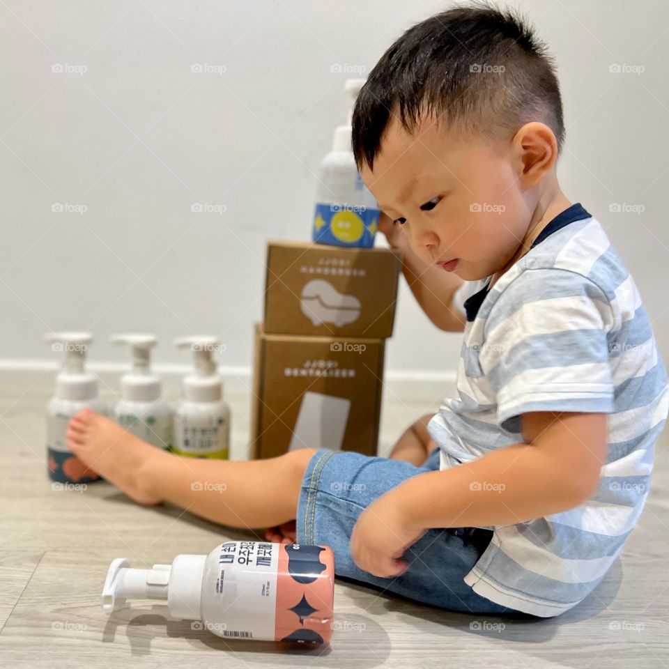 asian boy with Korean skincare baby products 