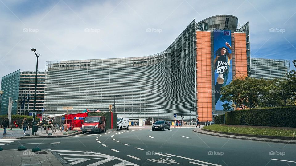 Beautiful view of the cruciform glass modern building of the European Parliament in the center of Brussels in Belgium, close-up side view. Belgium building concept.