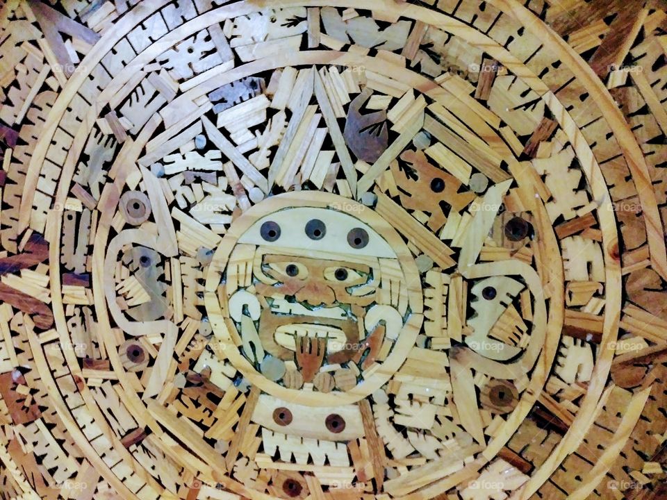 center of handmade wooden aztec calendar