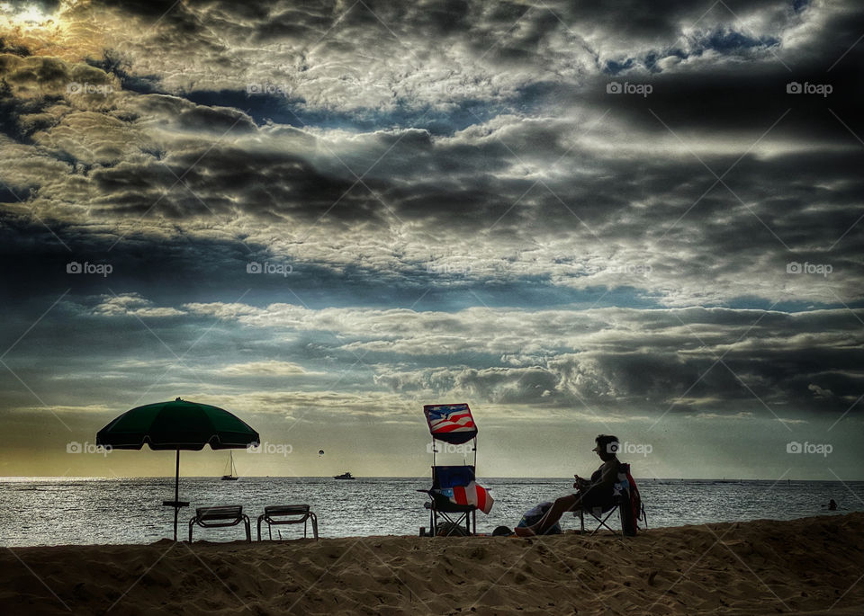 Social distancing while reading on the beach