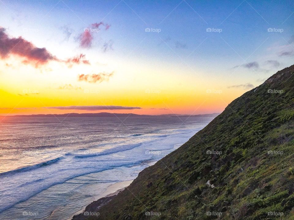 Mountain and ocean sunset 