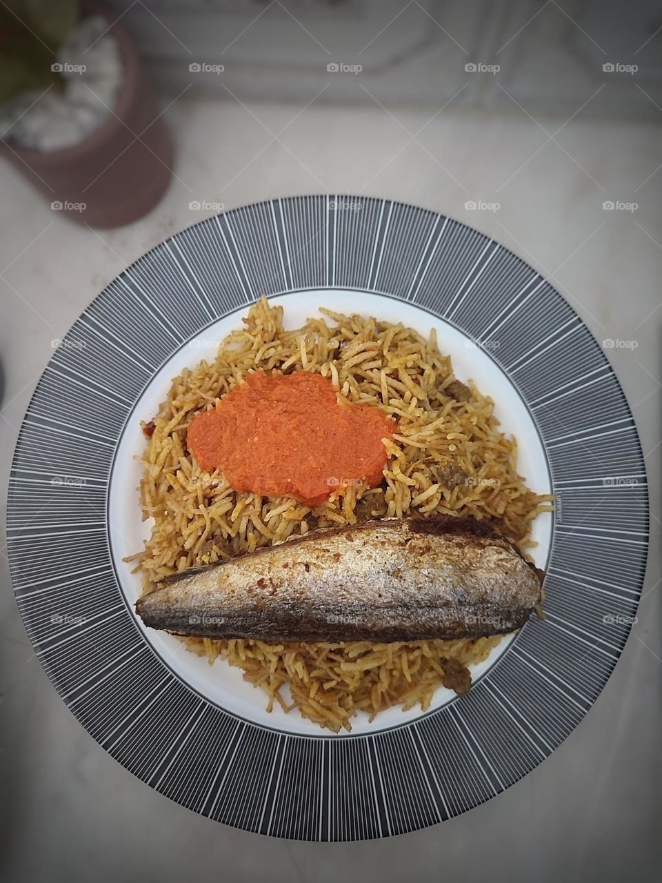 traditional basmati rice with fish and tomato souce