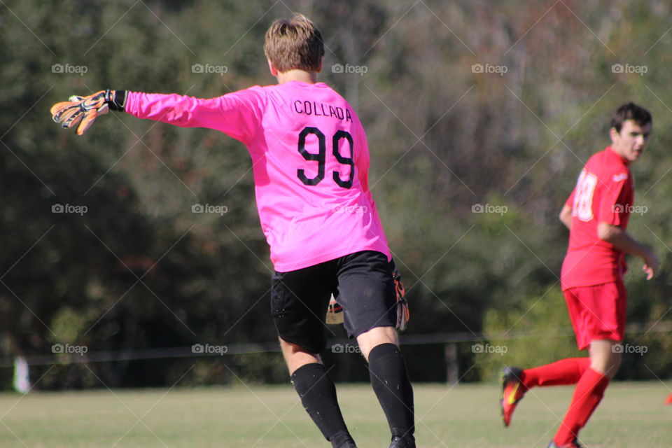 Soccer goalie in pink
