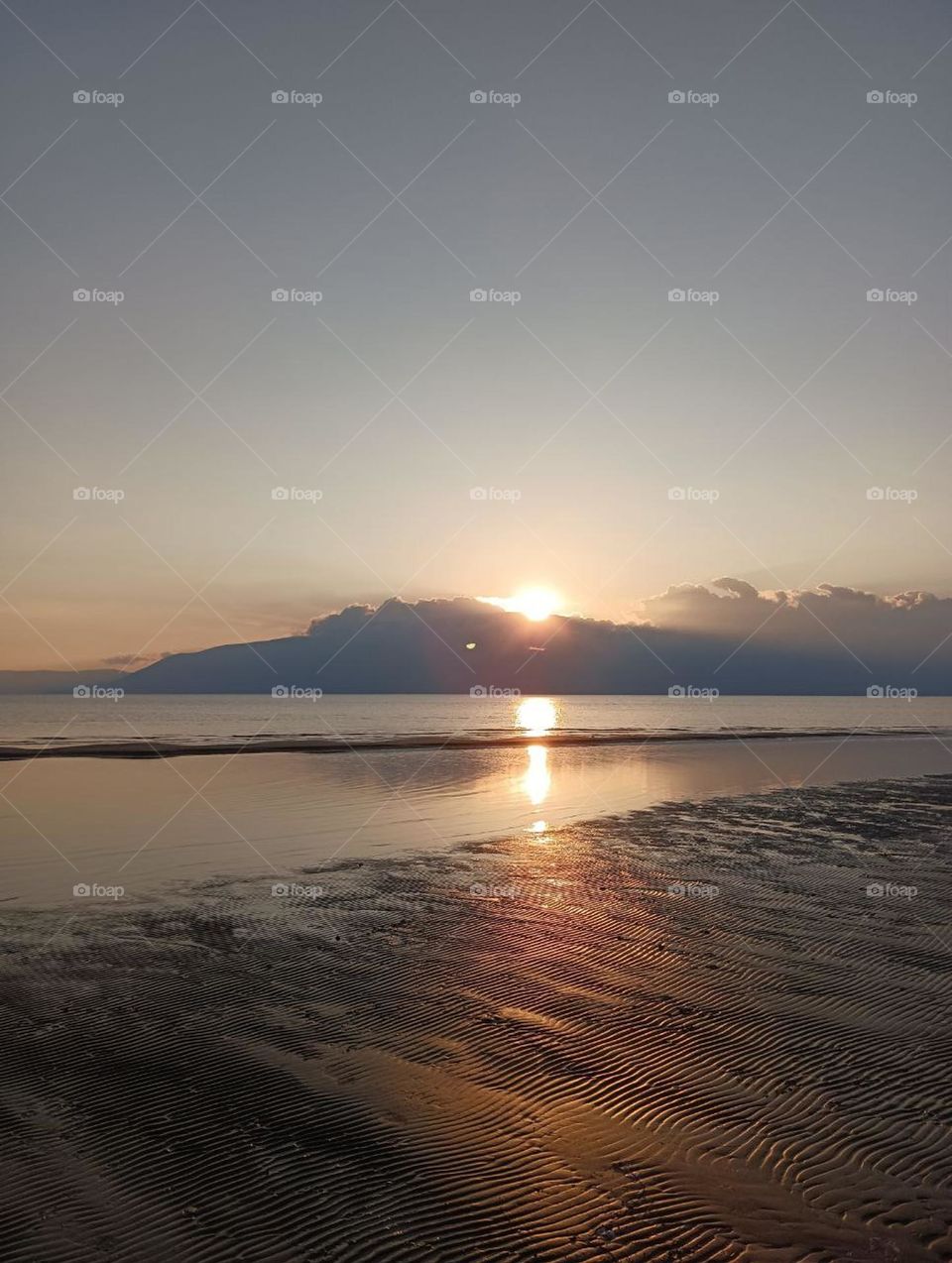 Beautiful view of sunset and mountains from the beach