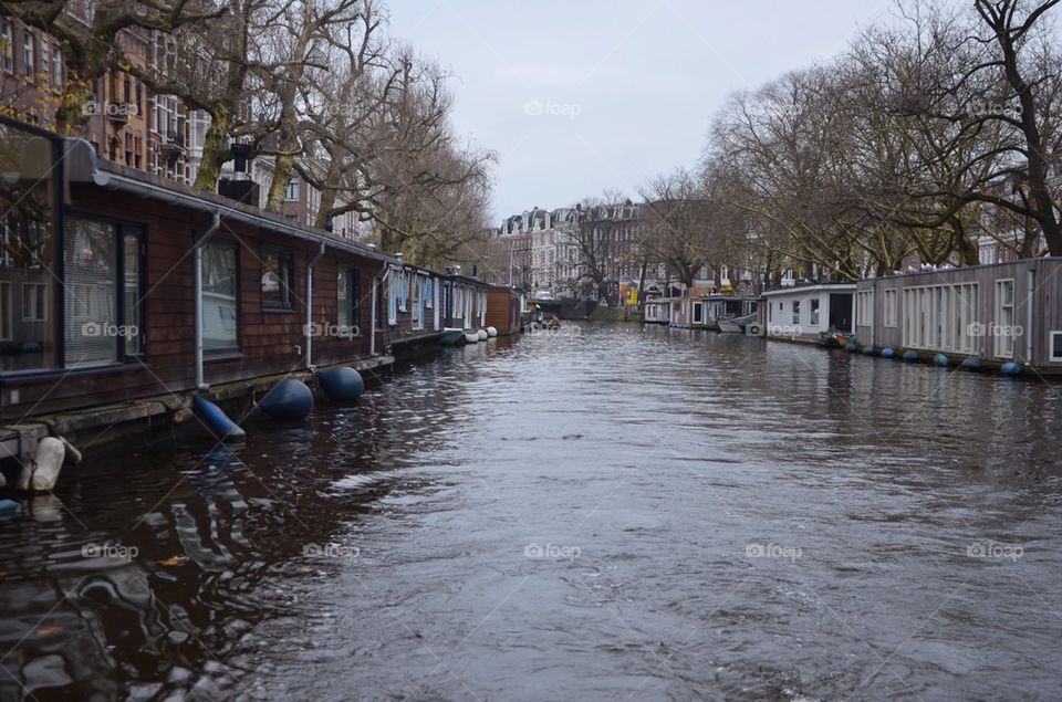 View over a canal with boat houses, Amsterdam, Netherland