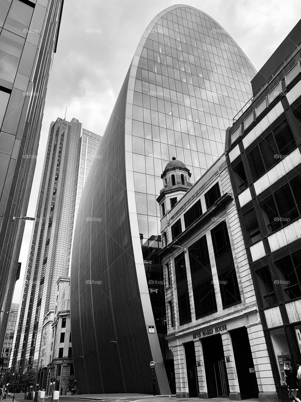 Oval-shaped crystal skyscraper stands out against London sky in the Aldgate district