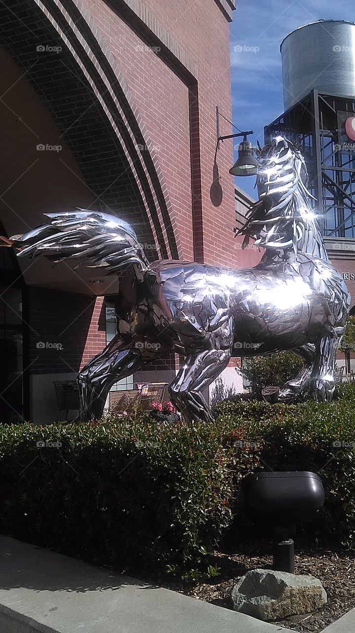 Metal horse. Walking to the store