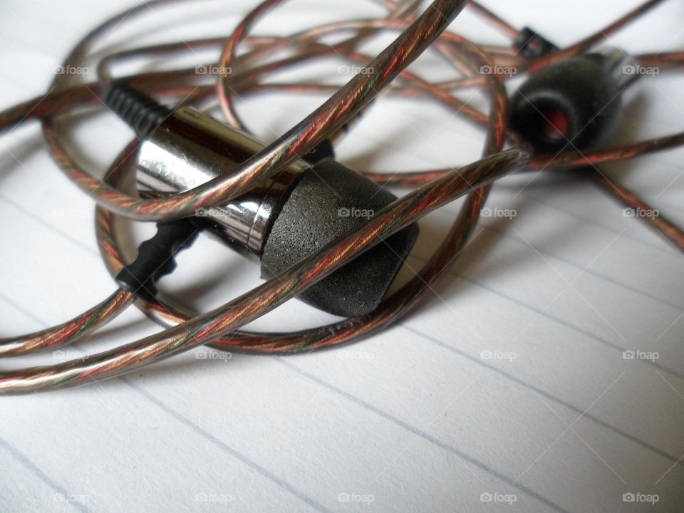 headphones lying on a white sheet