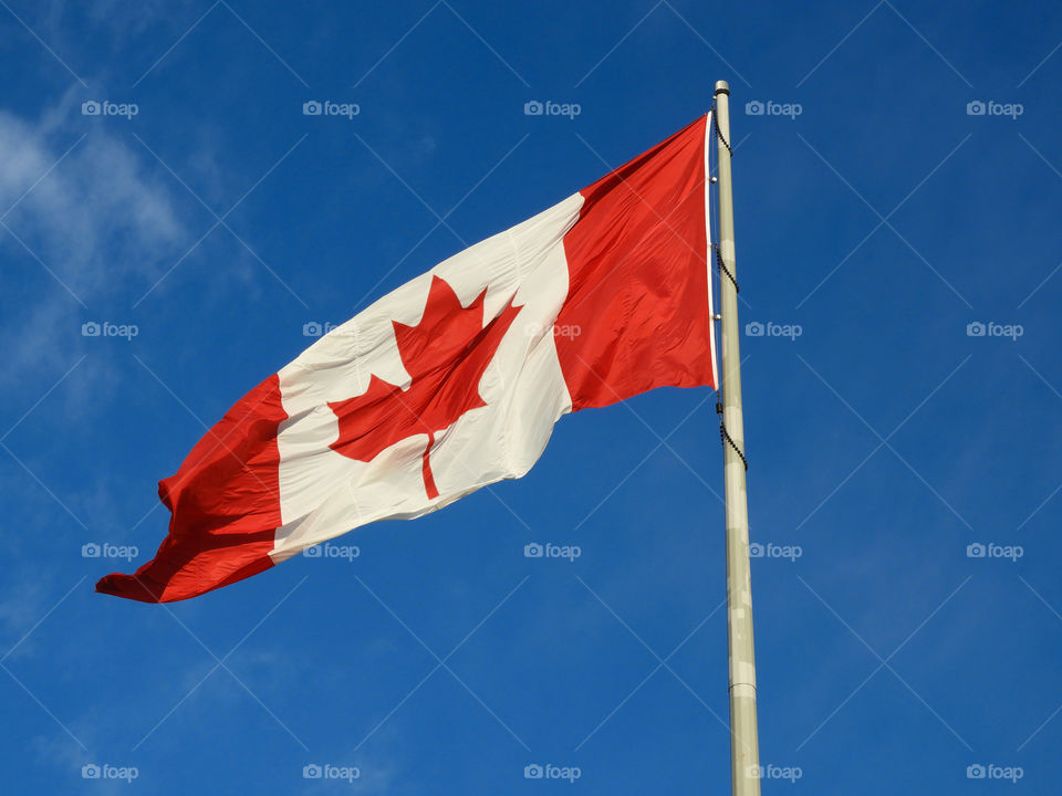 large Canadian flag blowing in the wind