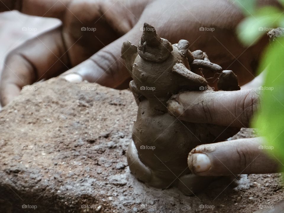 A clay model is getting made