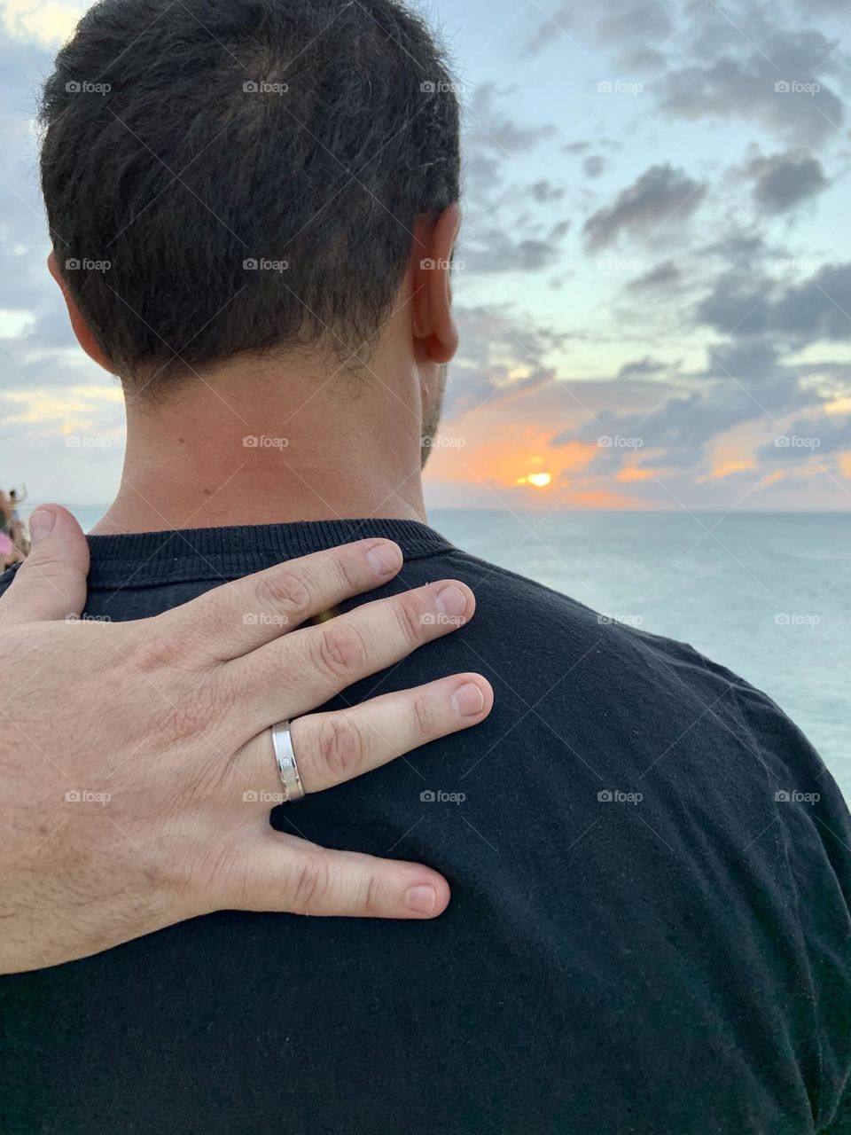 Man Wedding promise ring at sunset 