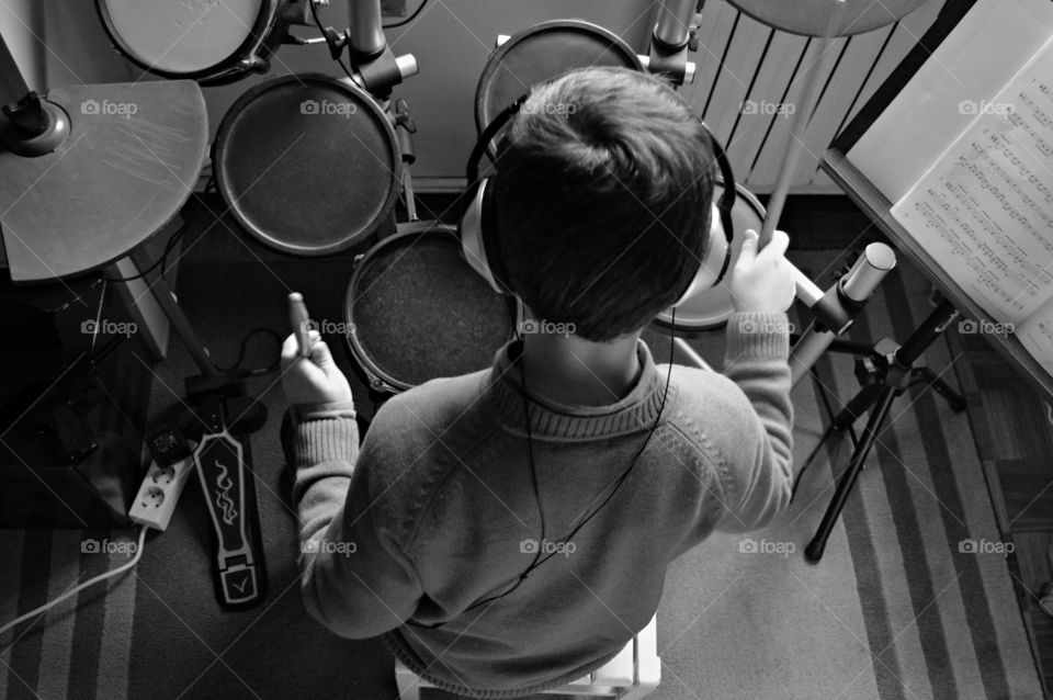 Drummer. My little drummer playing his electronic drum set