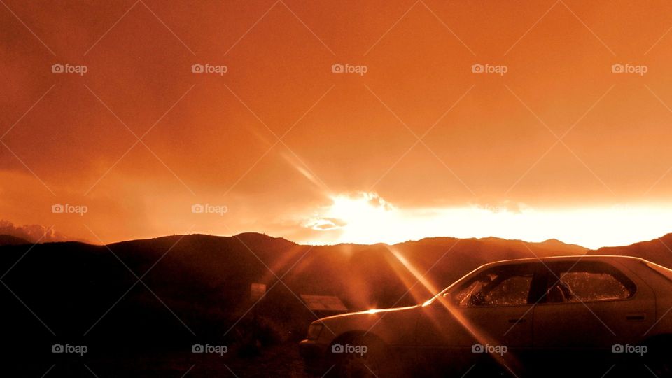 Red Sun Rays. Lovely red sunset over the Colorado Mountains