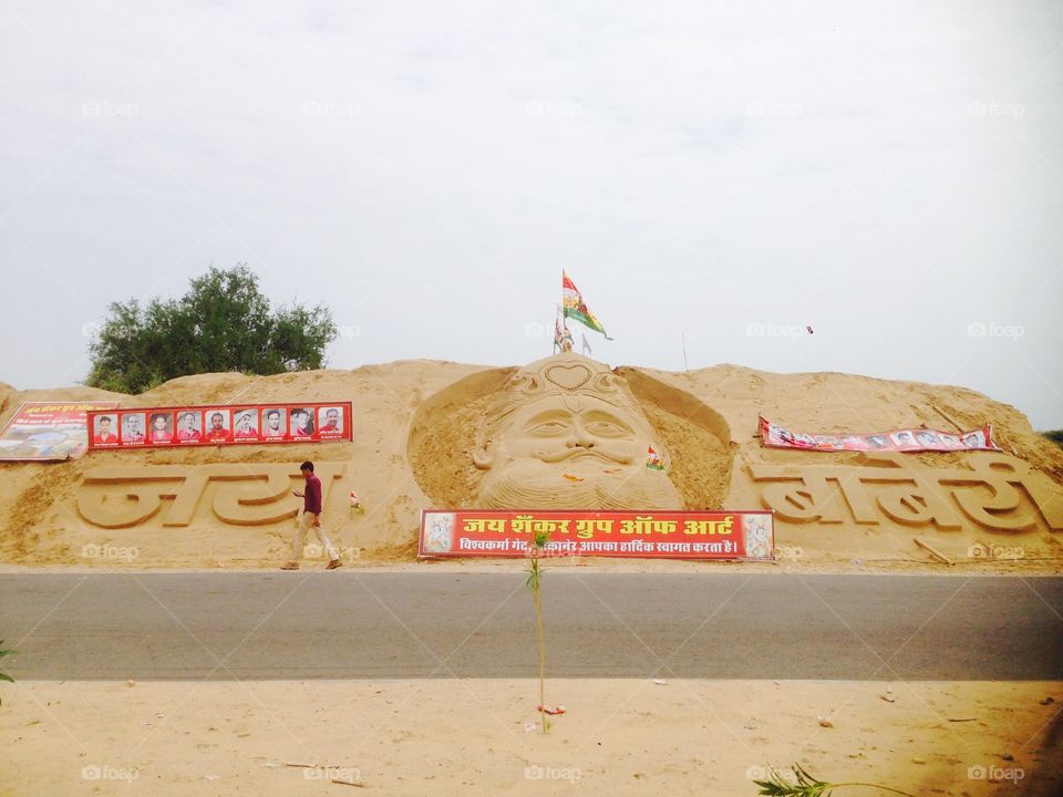 Outside art on anywhere and here you see some characters of Hindi and biggest image of baba ramdev on ramdev festival.
