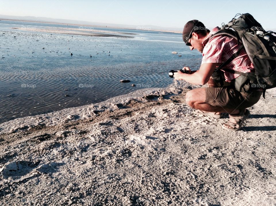 Photographer. Photographer getting an awesome lake shot