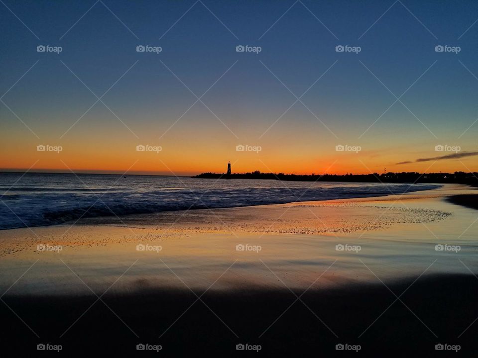 Colorful lighthouse sunset at Santa Cruz
