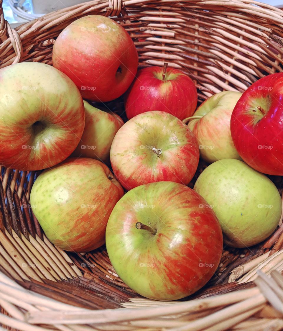 Juicy apples in a wicker basket