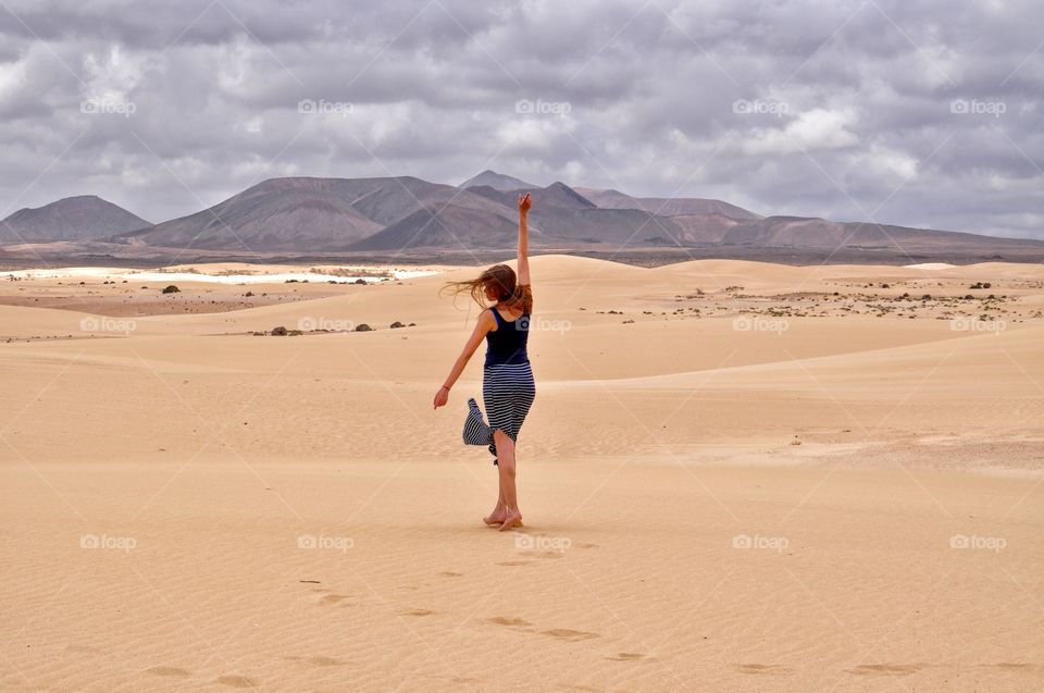 freedom in sandy dunes of corralejo on fuerteventura canary island in spain