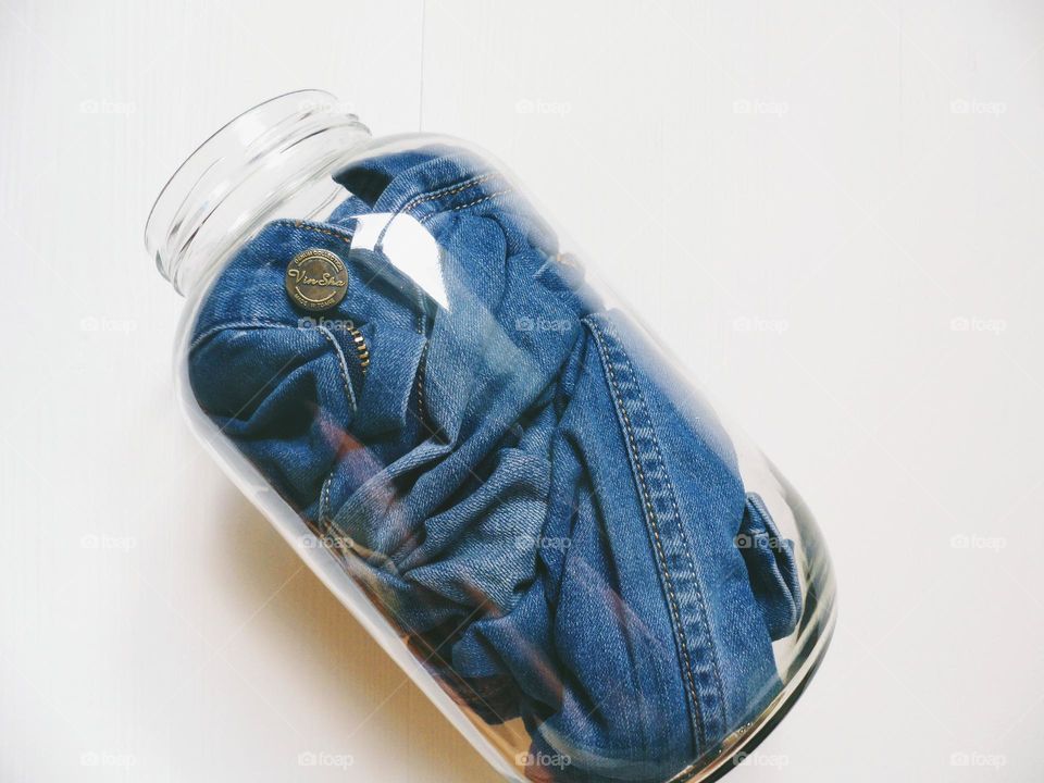 pants jeans in a glass jar