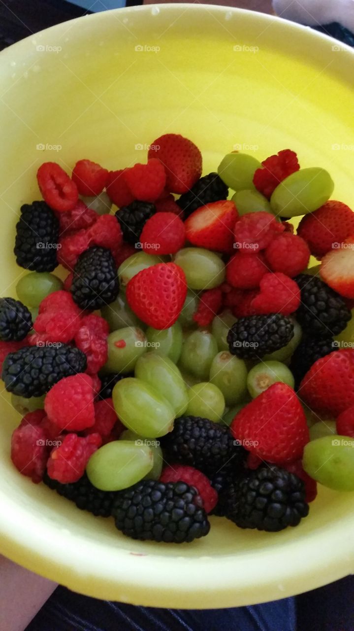 Fresh blackberries, raspberries, strawberries, and green grapes