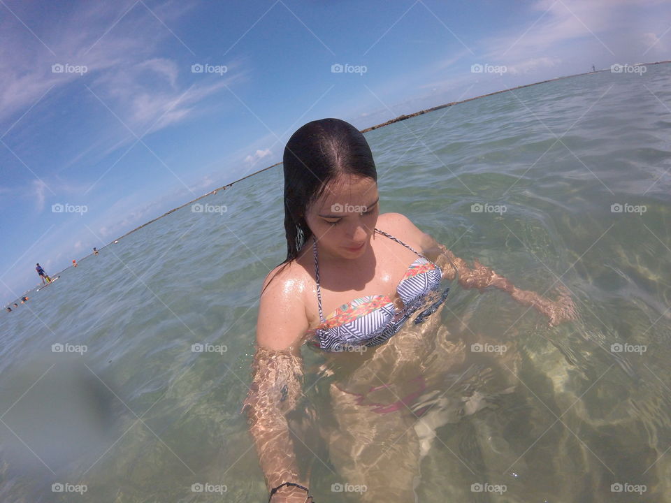 Portrait of a woman swimming in sea