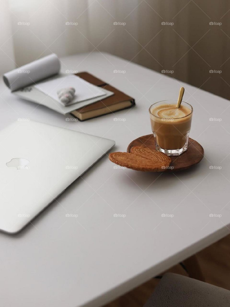 I need a simple and quiet desk because of the obsessive and relaxing hemisphere of my brain. Simple, clean, useful. Some manuscripts, MacBook and definitely coffee