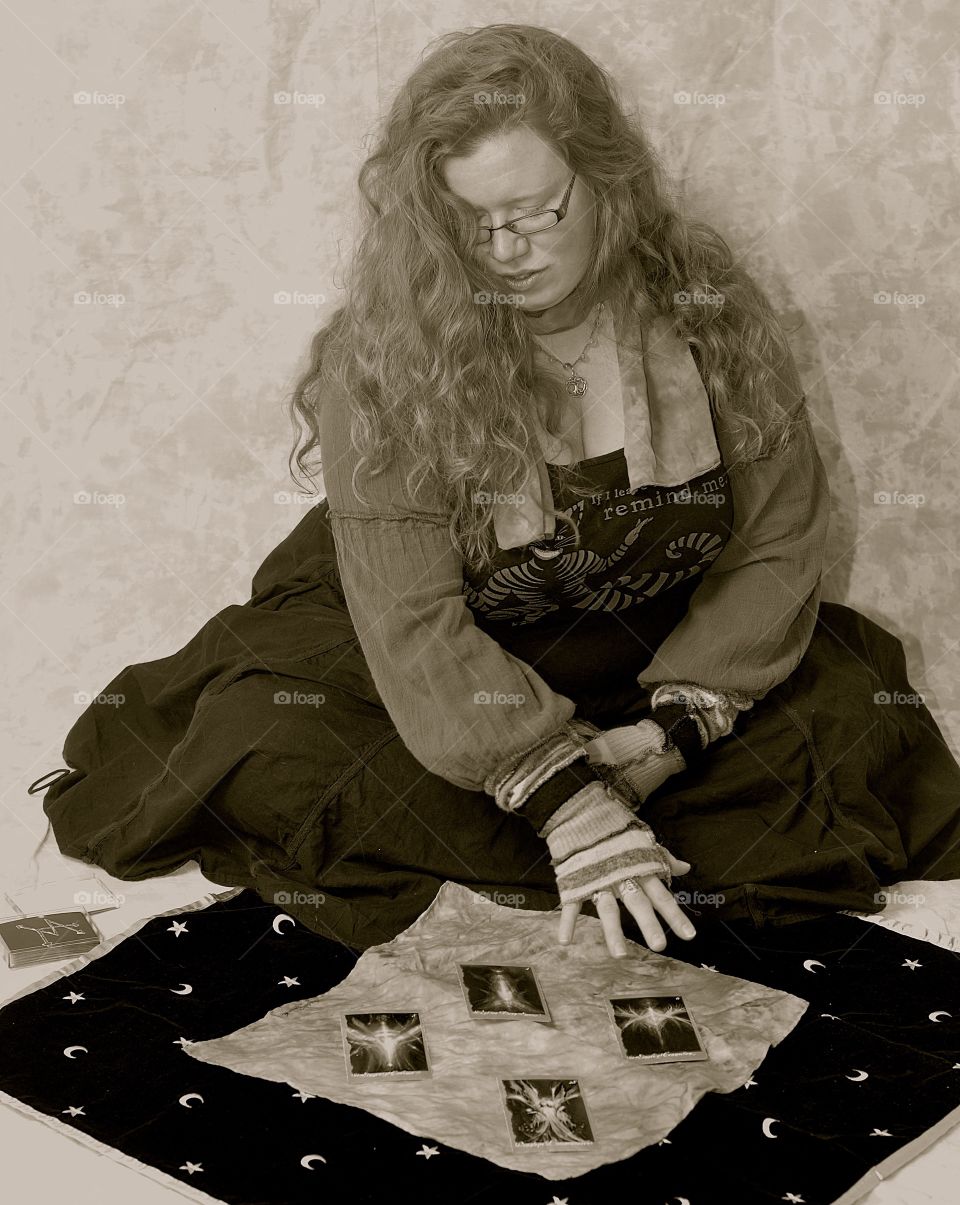 Card reader. Girl reading tarot cards